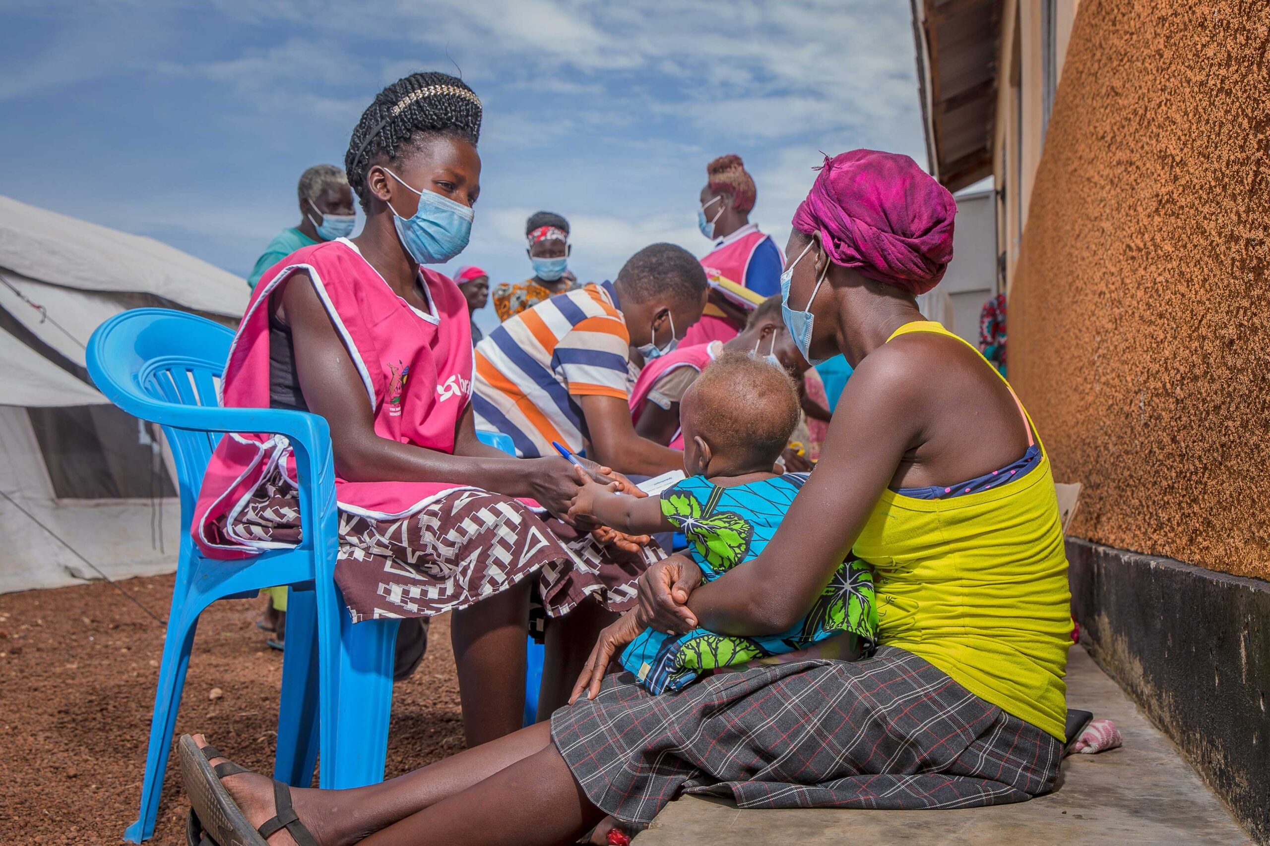 A woman and her child receive care in Uganda