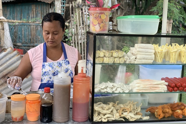 woman at her food stand