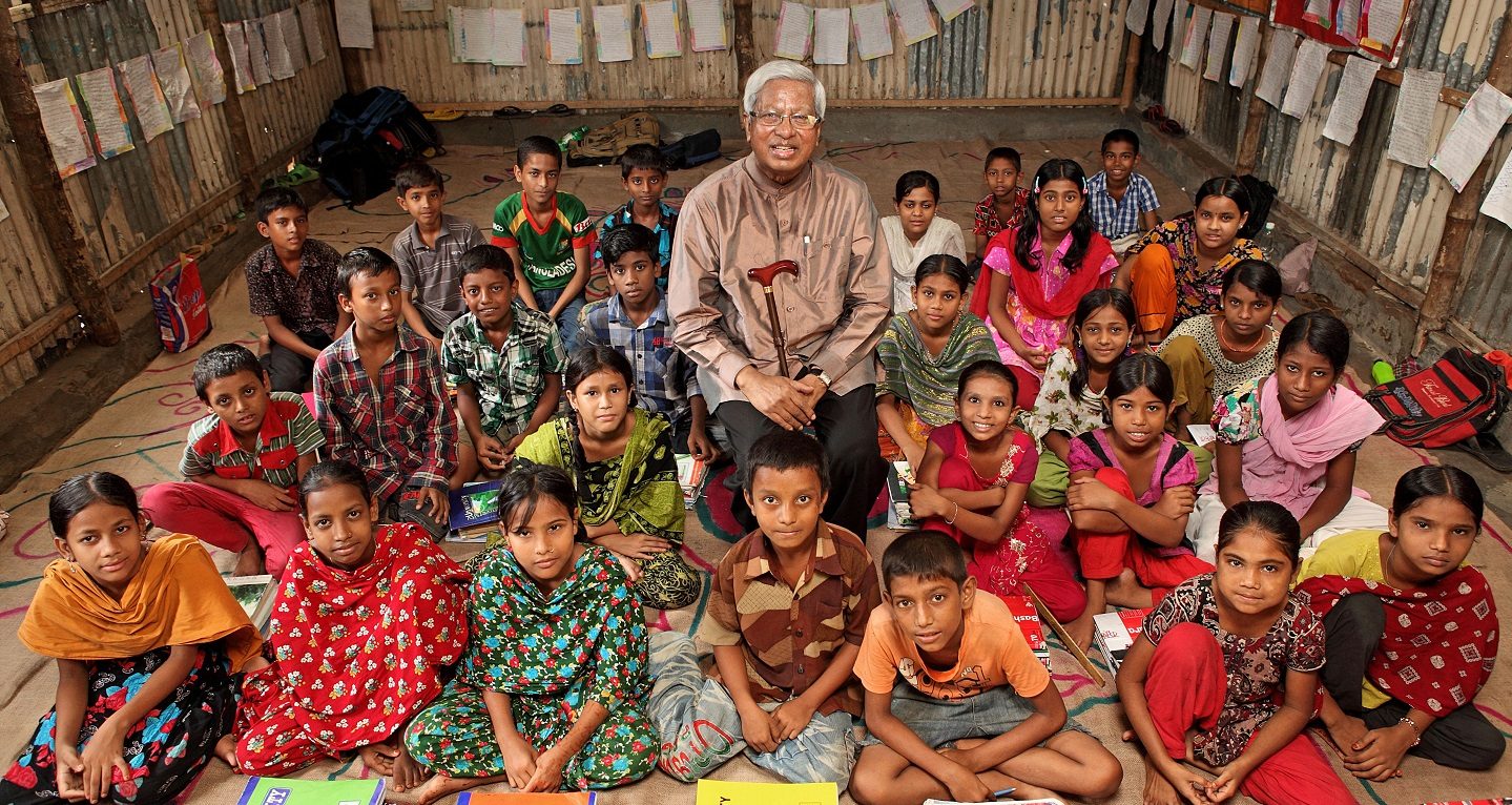 Sir Fazle with children at a learning center in Bangladesh.