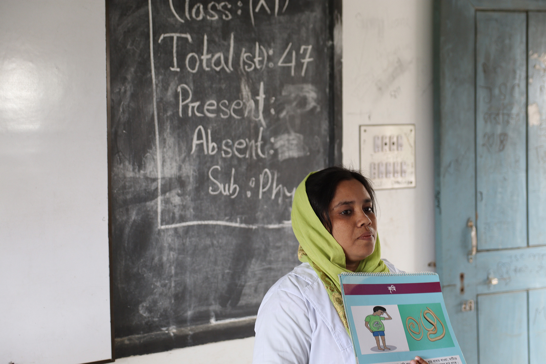 BRAC staff raise awareness on deworming at a school