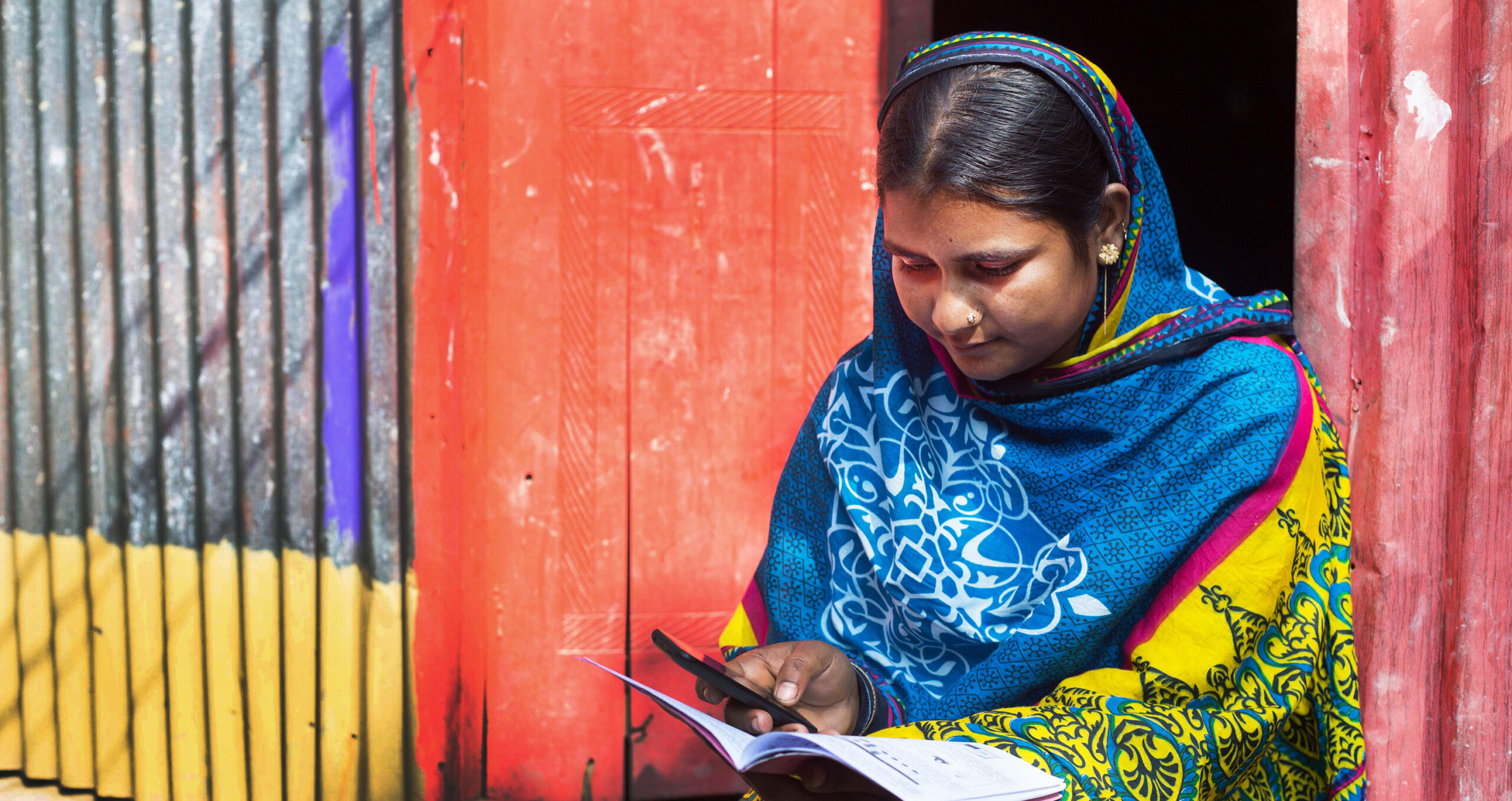 Woman using bKash, a mobile money service