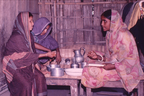 A BRAC community health worker teaches mothers how to make oral rehydration solution at home to treat their children for diarrheal diseases