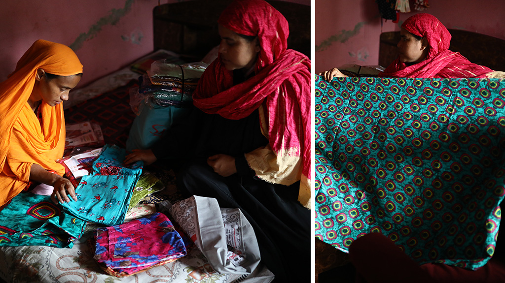 Nurjahan, a participant of BRAC's Ultra-Poor Graduation Program in Bangladesh, sells fabric at her small business.