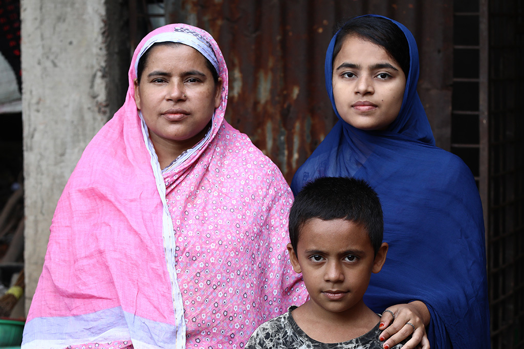 Nurjahan, a participant in BRAC's Ultra-Poor Graduation program in Bangladesh, with two of her children