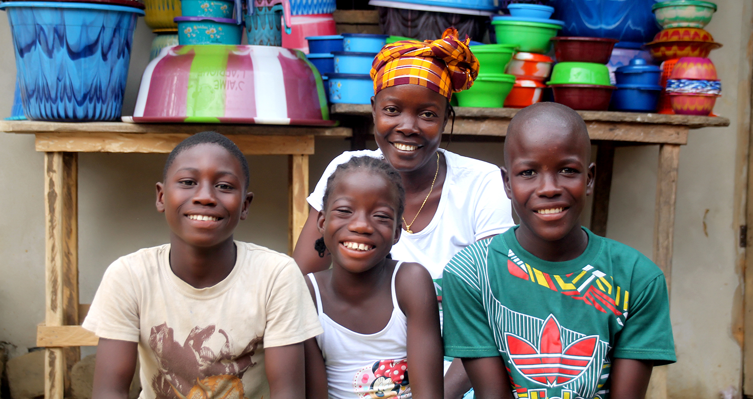 A Graduation participant with her children in Liberia