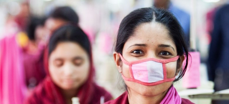 rohingya woman making a mask.