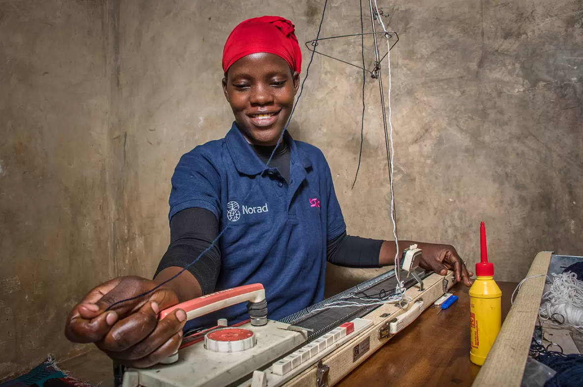 Hajara uses her knitting machine, which BRAC provided alongside skills training