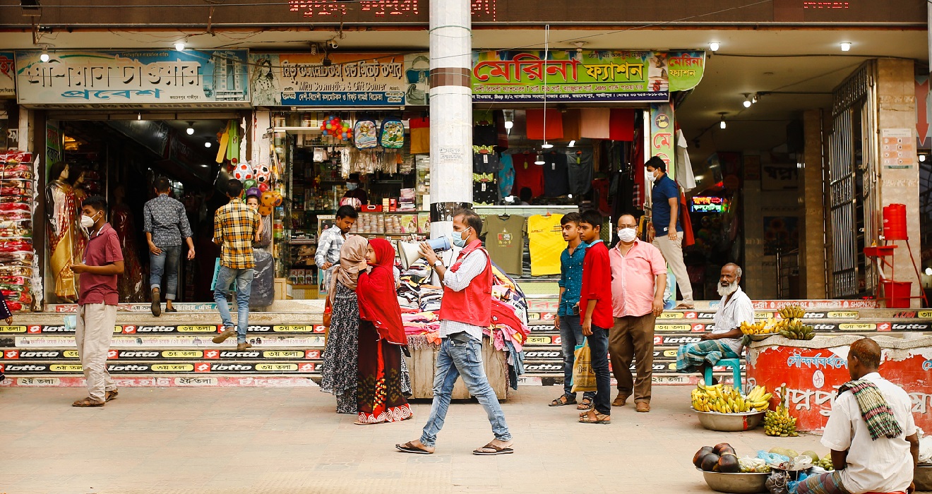 A BRAC worker spreading crucial information about COVID-19.