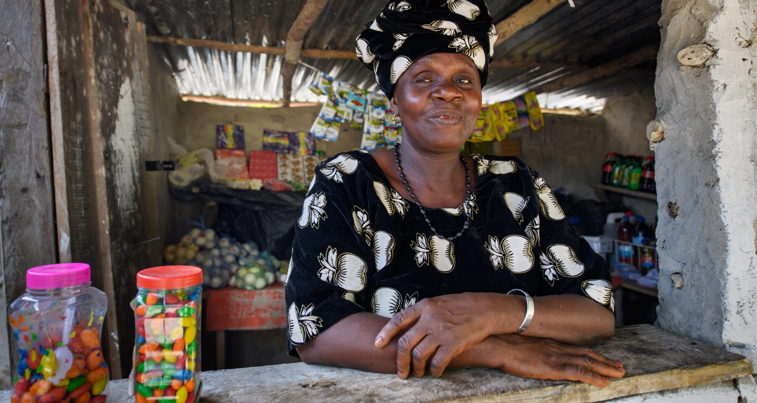 Kumba, a participant in BRAC's Ultra-Poor Graduation program in Liberia, poses in her shop