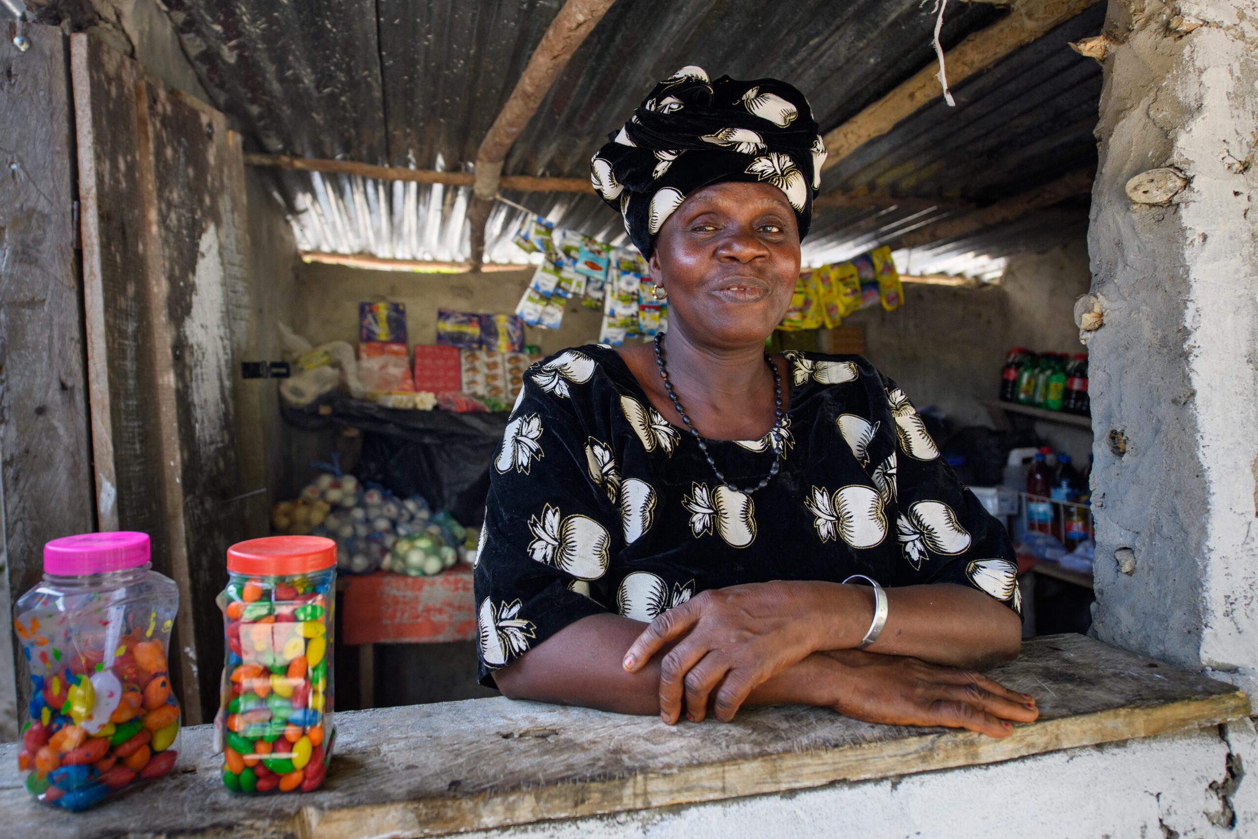 Kumba, a participant in BRAC's Ultra-Poor Graduation program in Liberia, poses in her shop