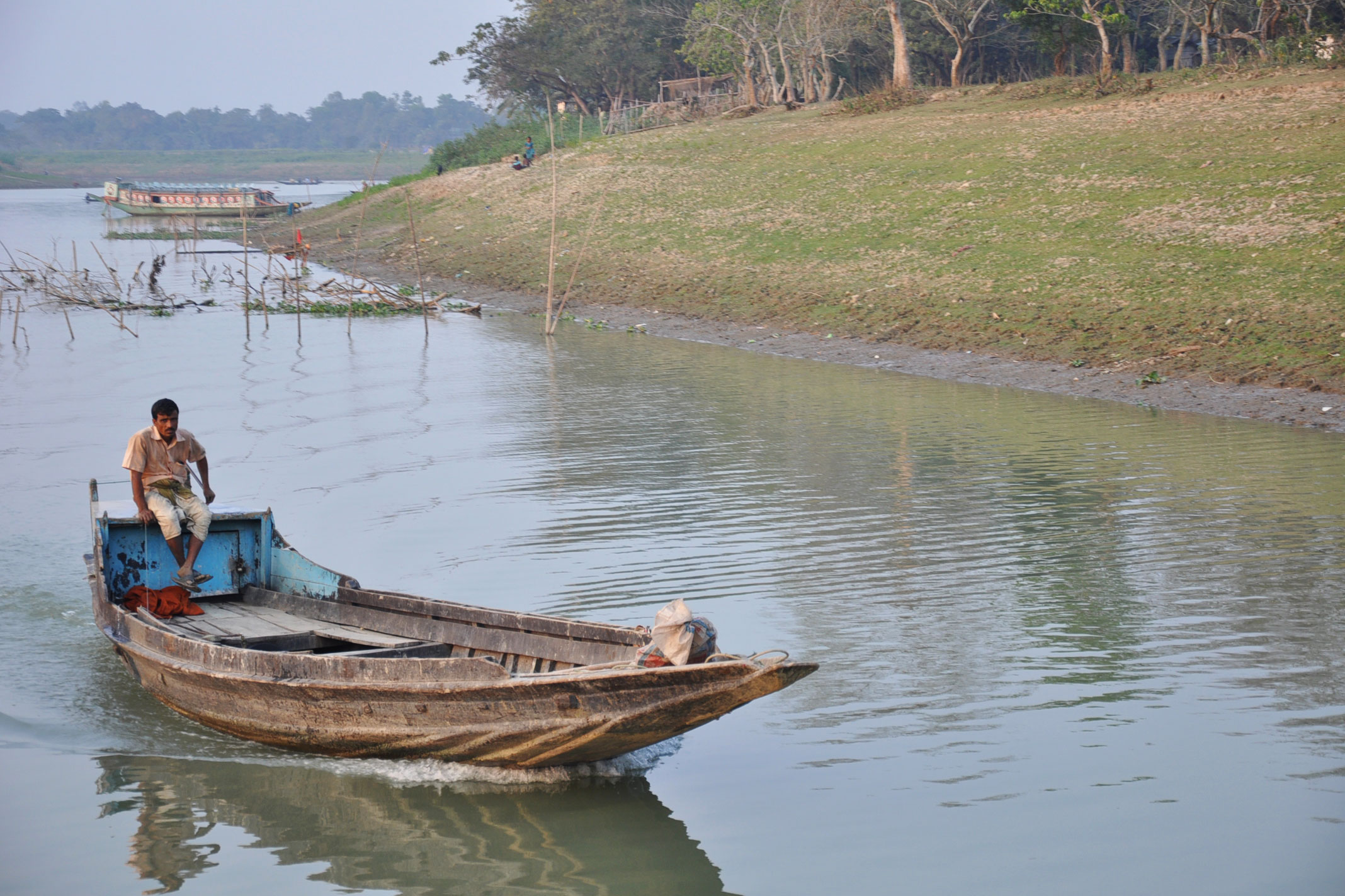 A man in a boat in flood-prone Bangladesh