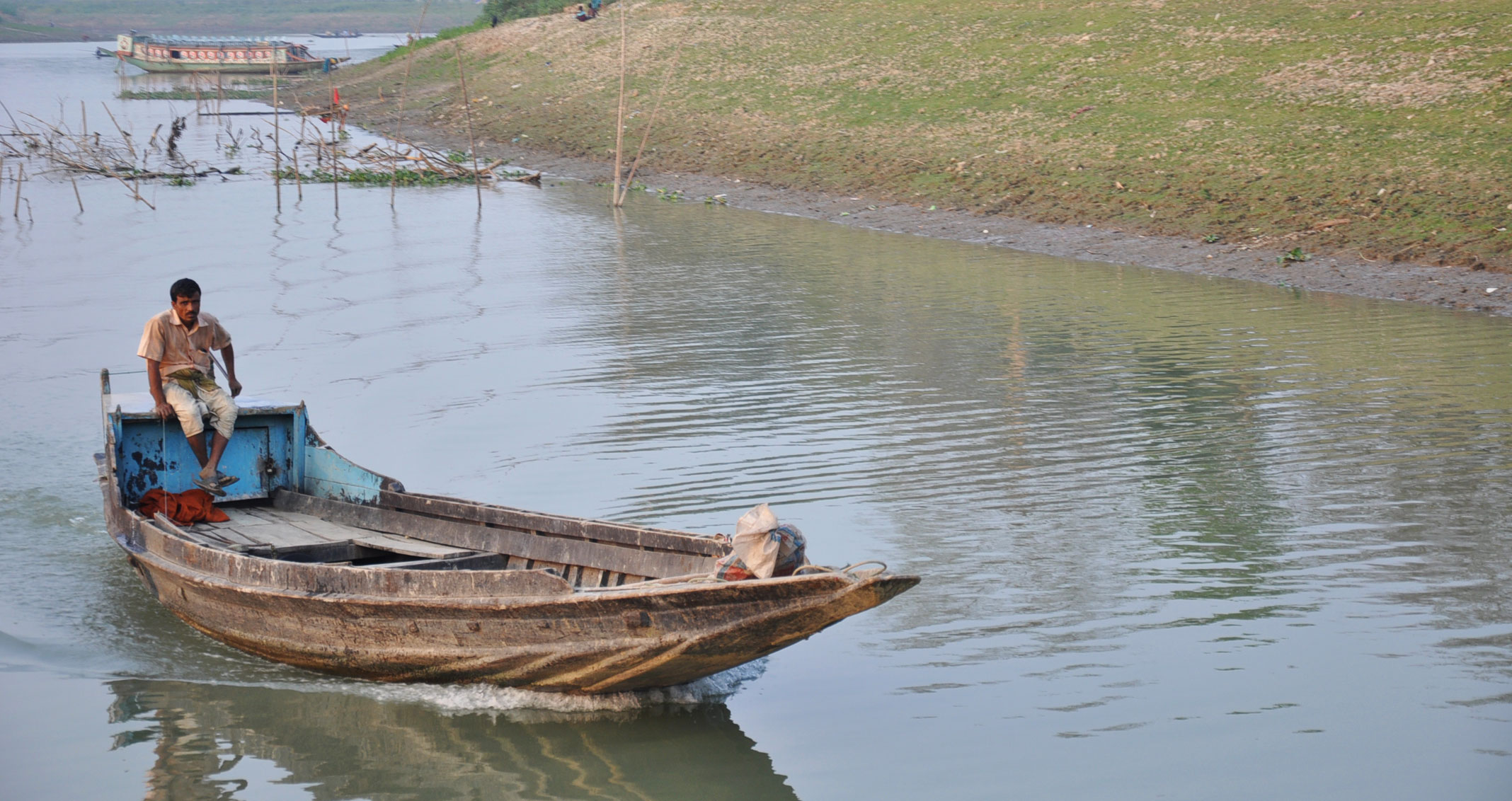 A man in a boat in flood-prone Bangladesh