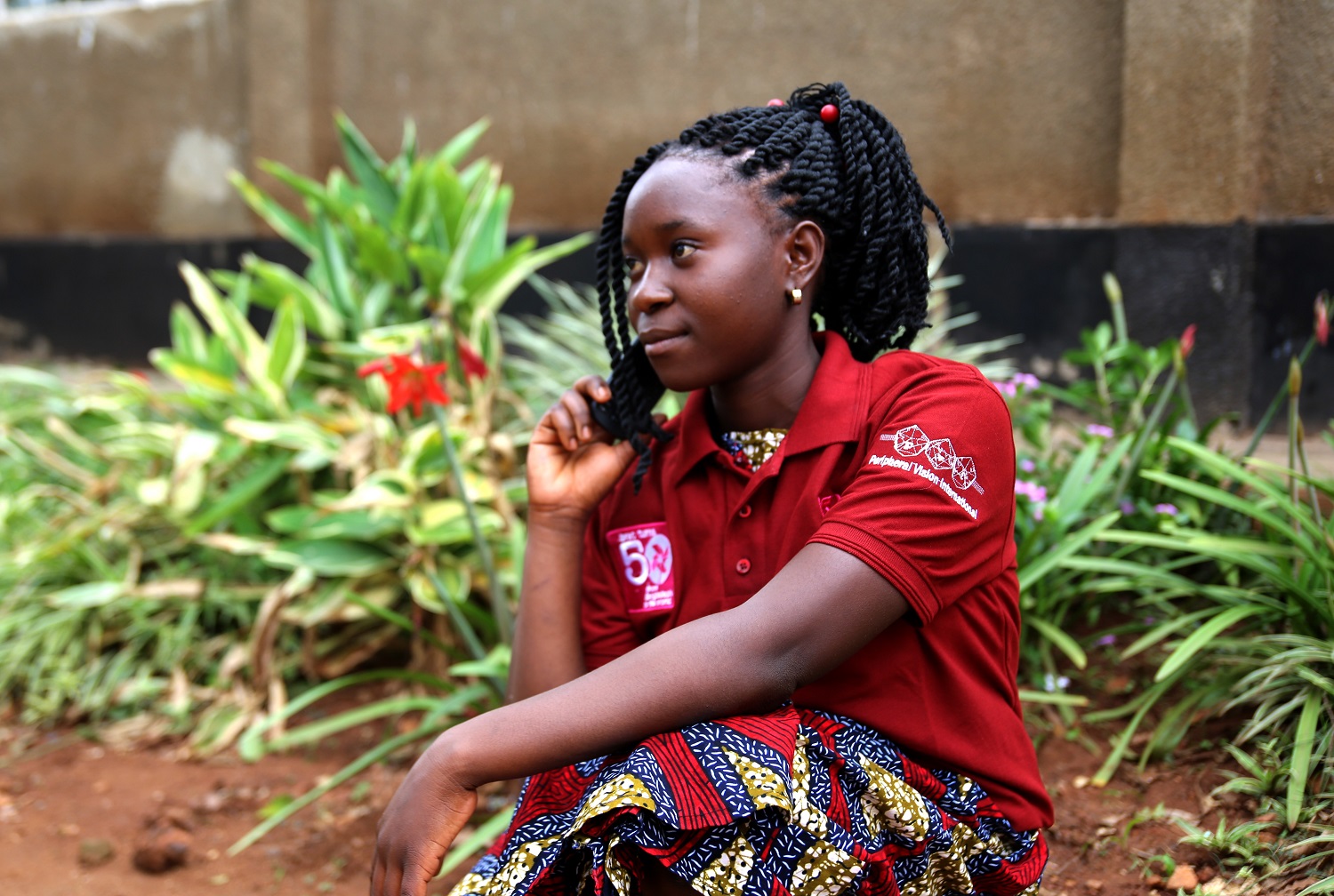 A girl in Uganda listens to BRAC Girls Talk