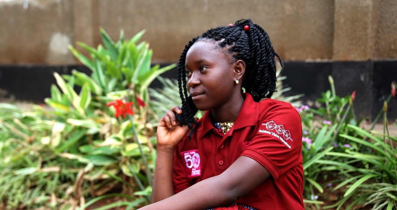 A girl in Uganda listens to BRAC Girls Talk