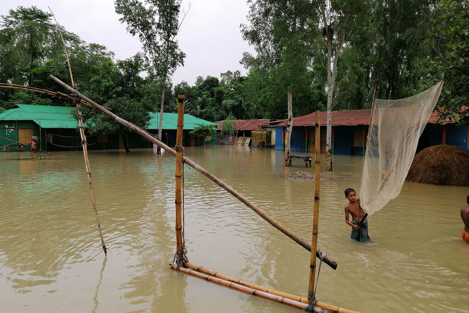 A flooded village demonstrates how climate change has caused unpredictable weather patterns around the world, including in flood-prone Bangladesh. 