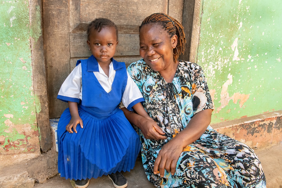 Angeline and her granddaughter at her home in Liberia