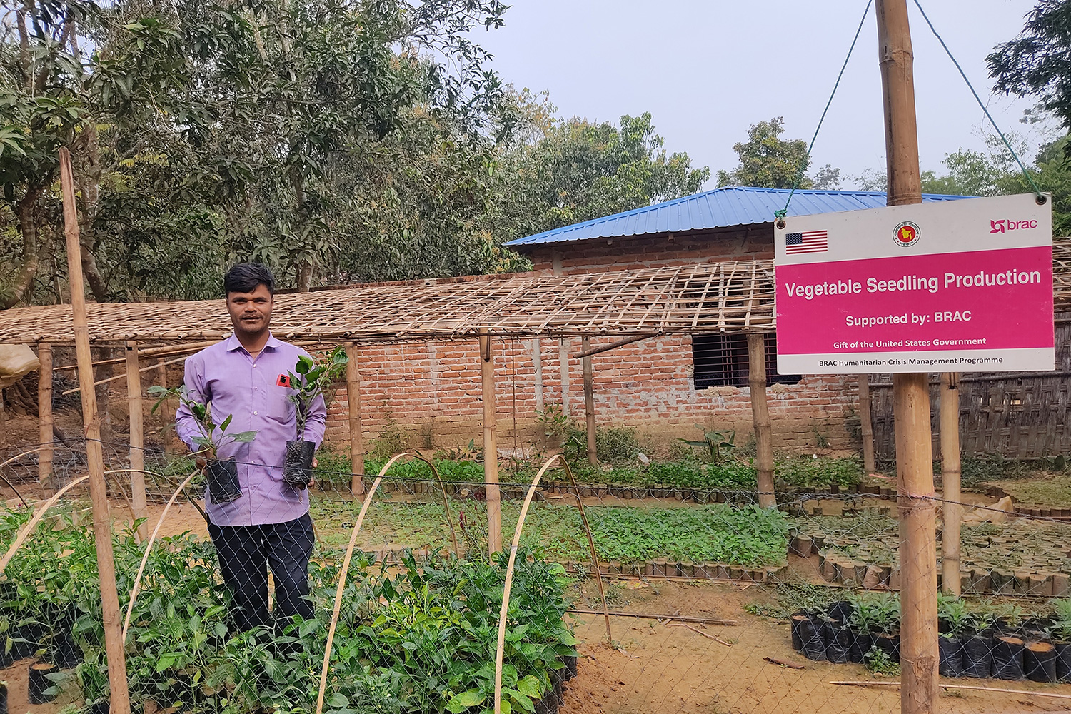 Ismail, a resident of Cox's Bazar, Bangladesh, whose community is hosting nearly a million Rohingya refugees, stands in his garden where he grows vegetables and nurses seedlings thanks to support from BRAC and the U.S. Department of State.