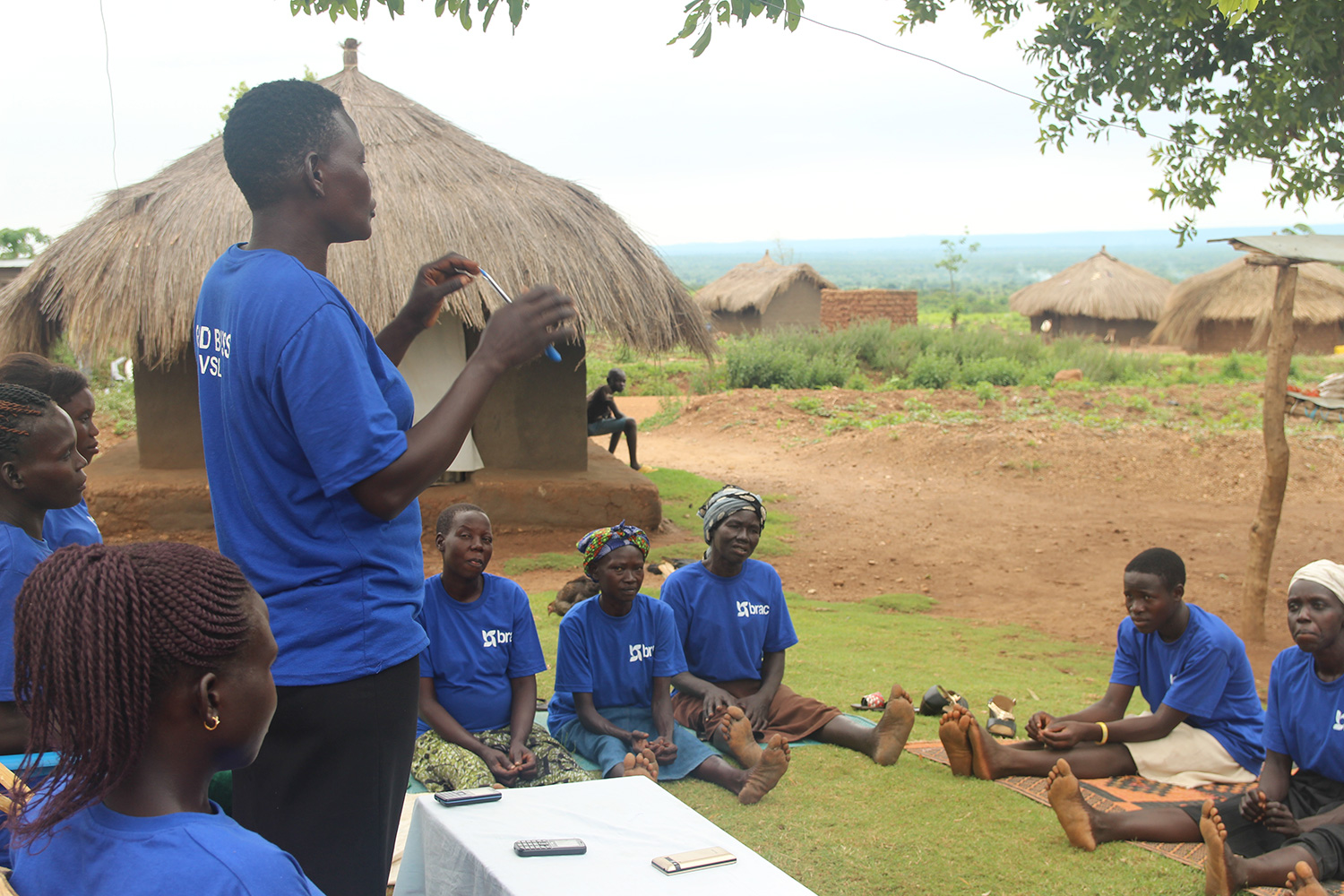 Annet leads a discussion at her village savings and loan association group meeting