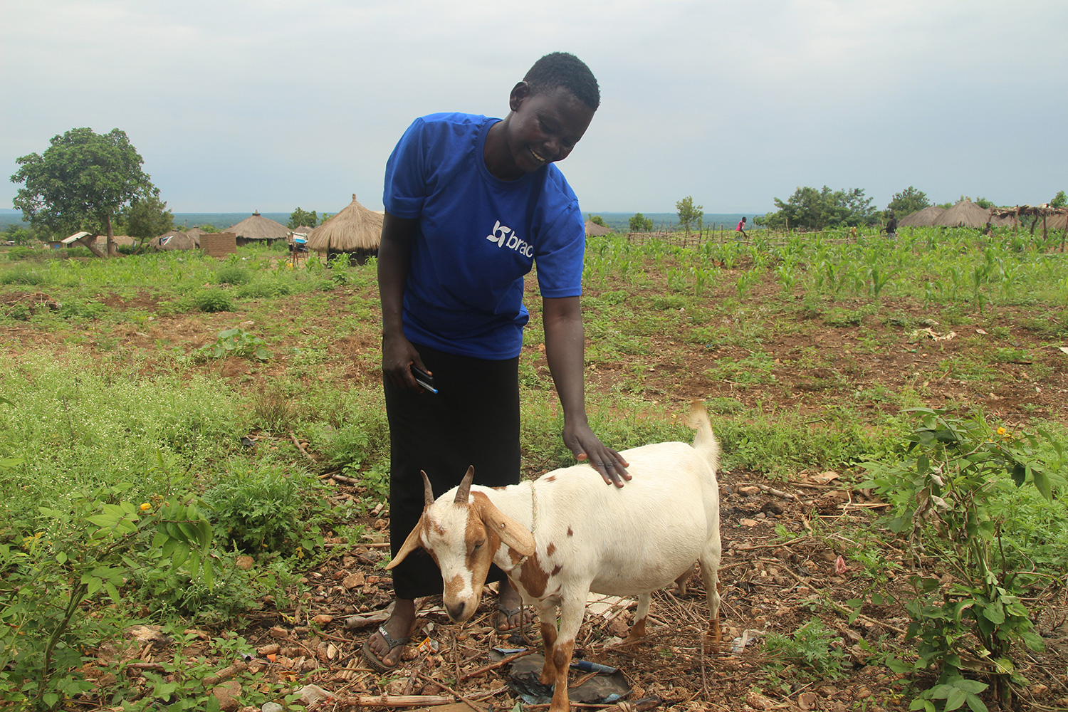 Annet pets one of her goats