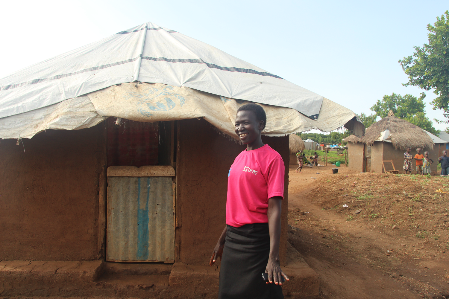 Sarah Jane in front of her home.