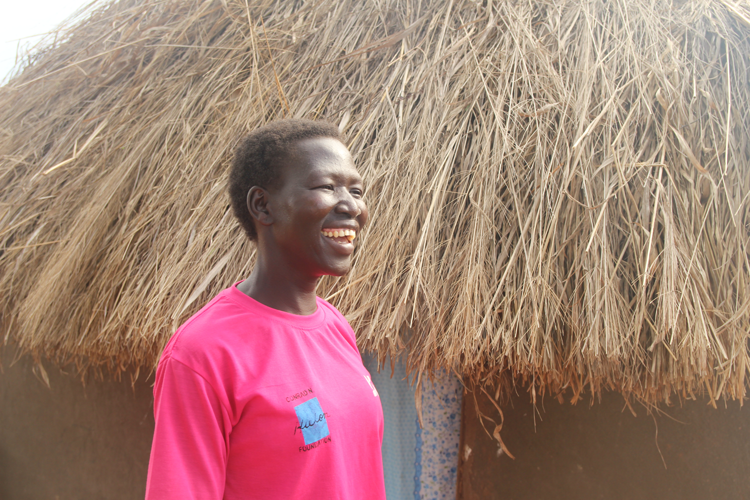 Annet leads a discussion at her village savings and loan association group meeting