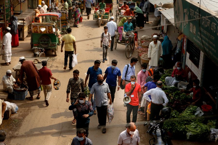 An overhead shot of a busy, bustling side street in Dhaka.