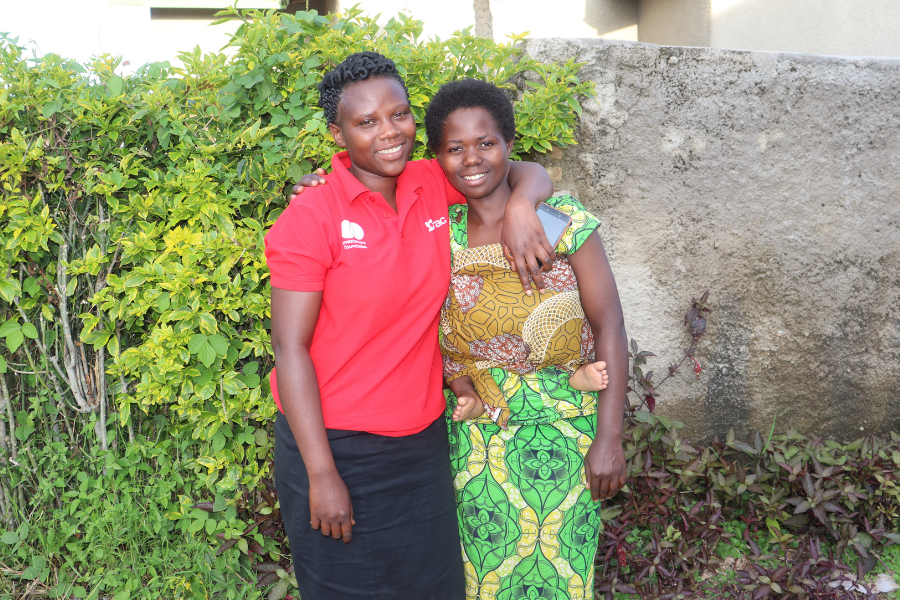 Angelique and her mentor pose together and smile.