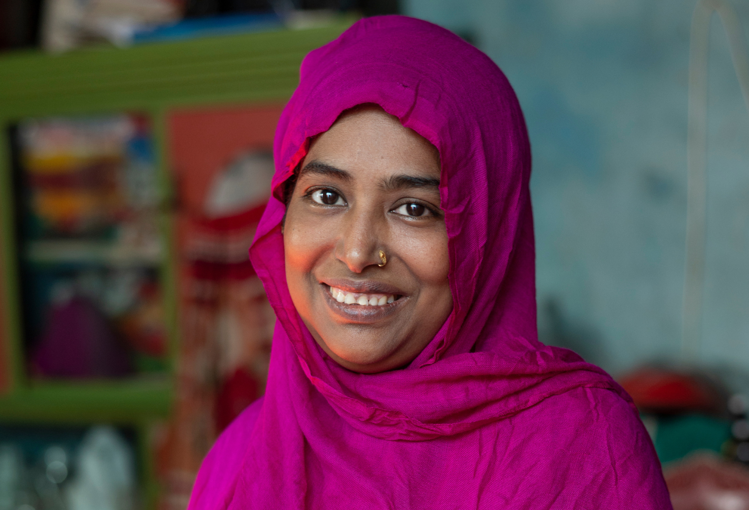 A portrait of a woman in BRAC's Ultra-Poor Graduation program in Bangladesh smiling.