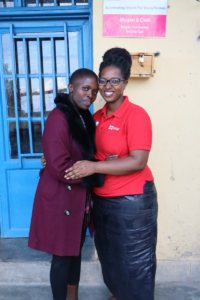 Liliane poses with a BRAC staff member