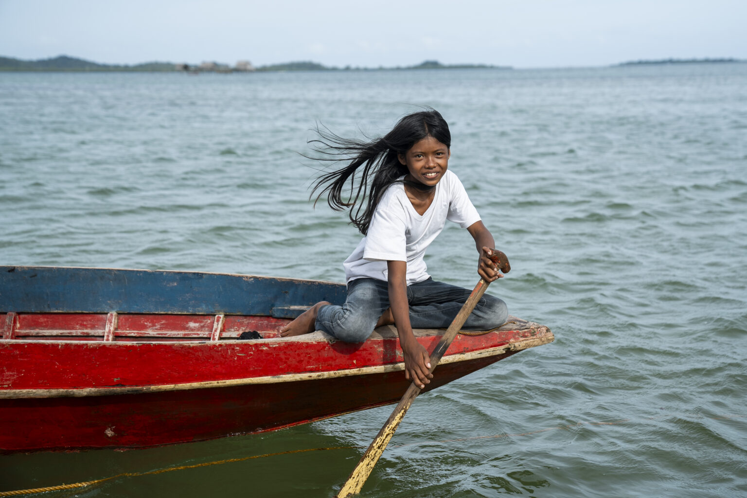 Surada A. Kasim, a student, rows a boat in Tawi-Tawi, Bangsamoro Autonomous Region in Muslim Mindanao (BARMM), Philippines, on October 22, 2024. Photo by Lisa Marie David