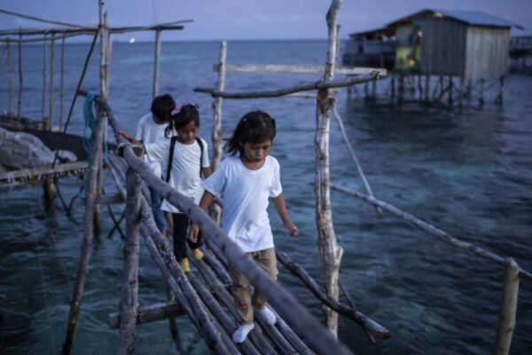 Students walk along a bridge at the stilts in Tawi-Tawi, Bangsamoro Autonomous Region in Muslim Mindanao (BARMM), Philippines, on October 22, 2024. Photo by Lisa Marie David