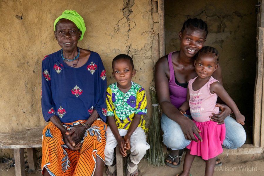 A family portrait in front Patience's home includes her mother, left, son, second from left, Patience, second from right, and daughter, right.